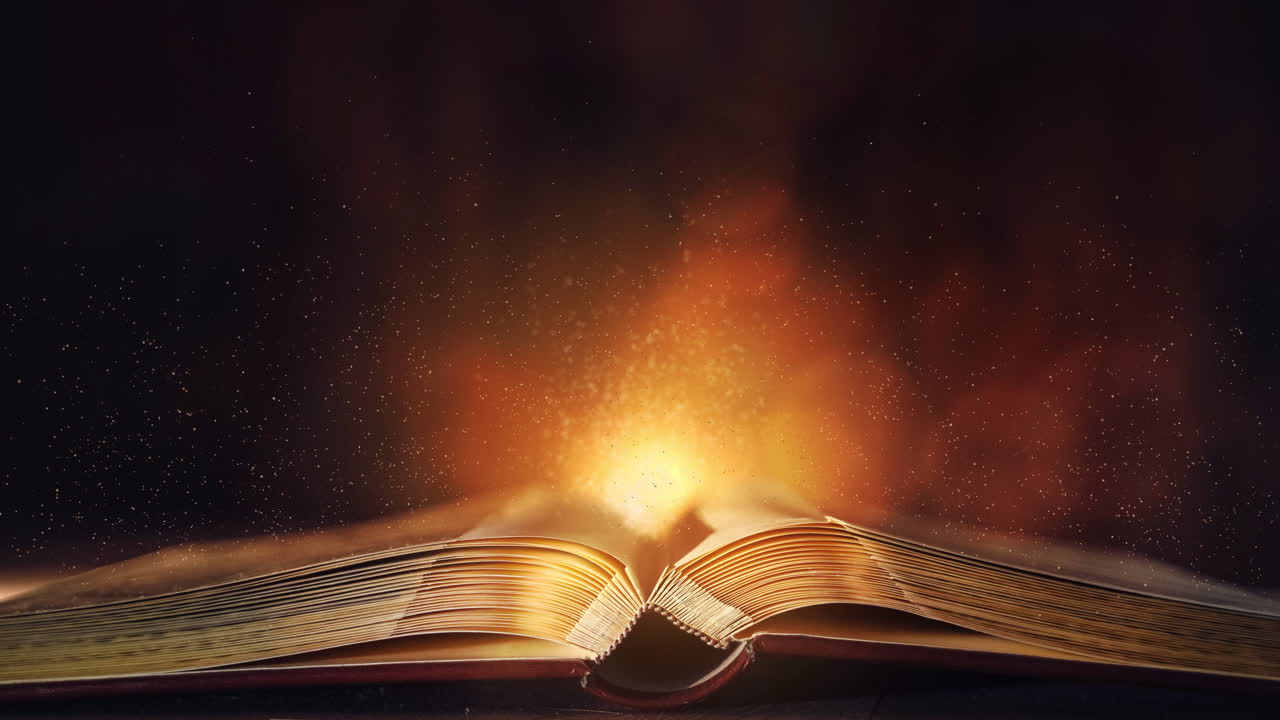 Looped animation of flying gold dust over an open vintage book on a dark background. Blinking magic light. Empty space for text.