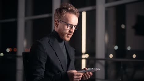 portrait stylish young man lists copies of money