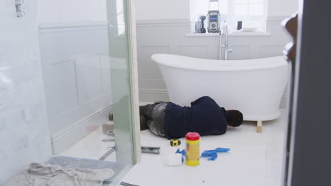 Plumber-In-Bathroom-Fitting-New-Free-Standing-Bath