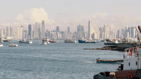 Panoramic-view-overlooking-the-boats-moored-in-the-Panama-Canal-marina,-in-the-distance-a-scenic-backdrop-of-the-spectacular-modern-buildings-and-beautiful-cityscape-of-Panama-City