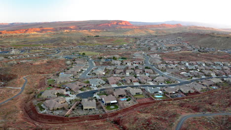 aerial view of a residential neighborhood in a desert landscape with red rock mountains