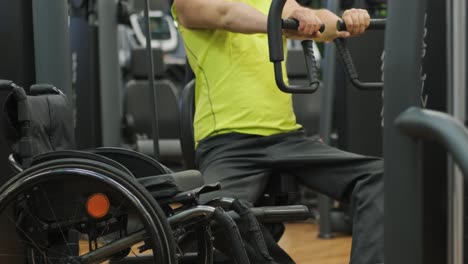 man with disabilities training in the gym of rehabilitation center