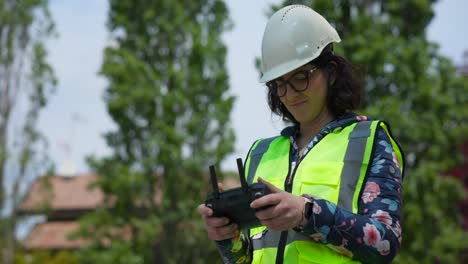 Female-engineer-with-remote-control-for-Mavic-3E-professional-photogrammetry-drone