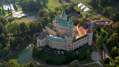 cinematic downward angle drone shot of bojnice castle, castle of spirits, in slovakia