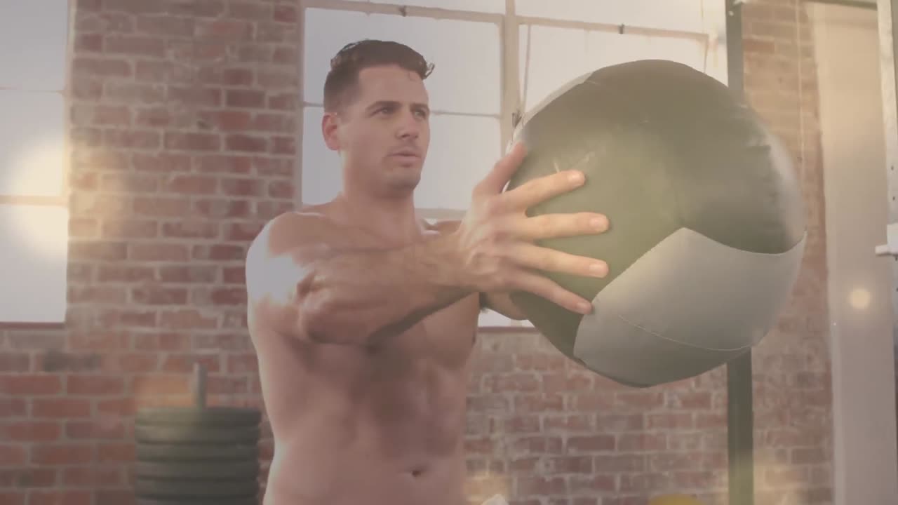 체육관에서 운동하는 백인 남성에 대한 빛의 반점 애니메이션.