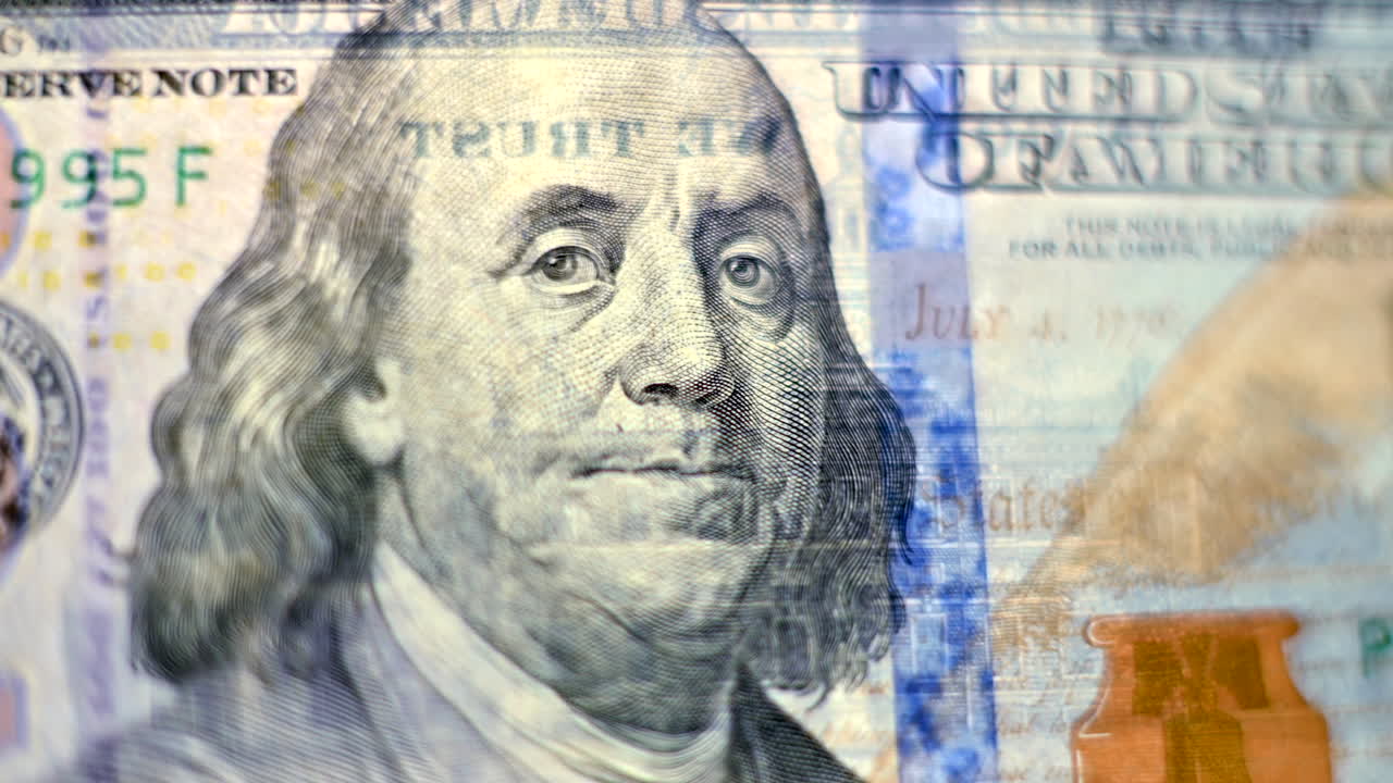 Close up of Benjamin Franklin portrait on the 100 dollar note