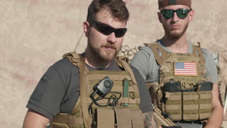 portrait of brutal men with guns