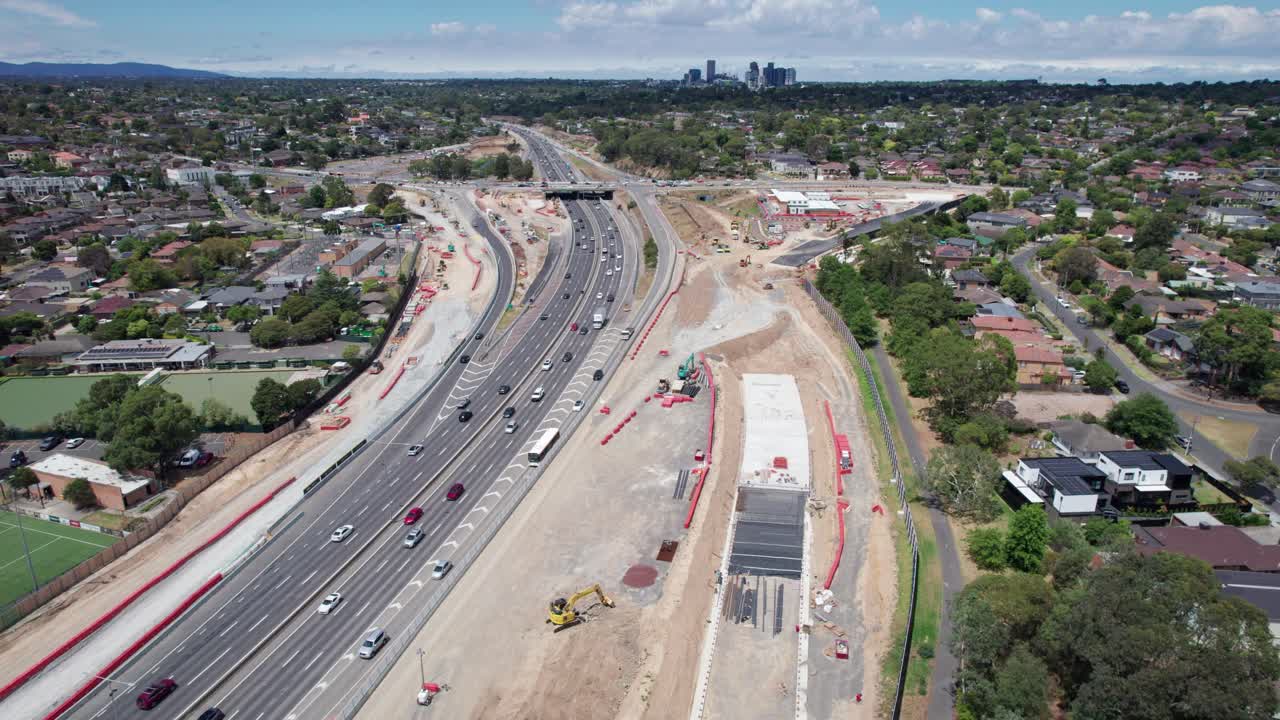 Aerial view looking south east along the Eastern Freeway towards the Doncaster Road intersection during construction of the North East Link project in February 2025, Victoria, Australia.