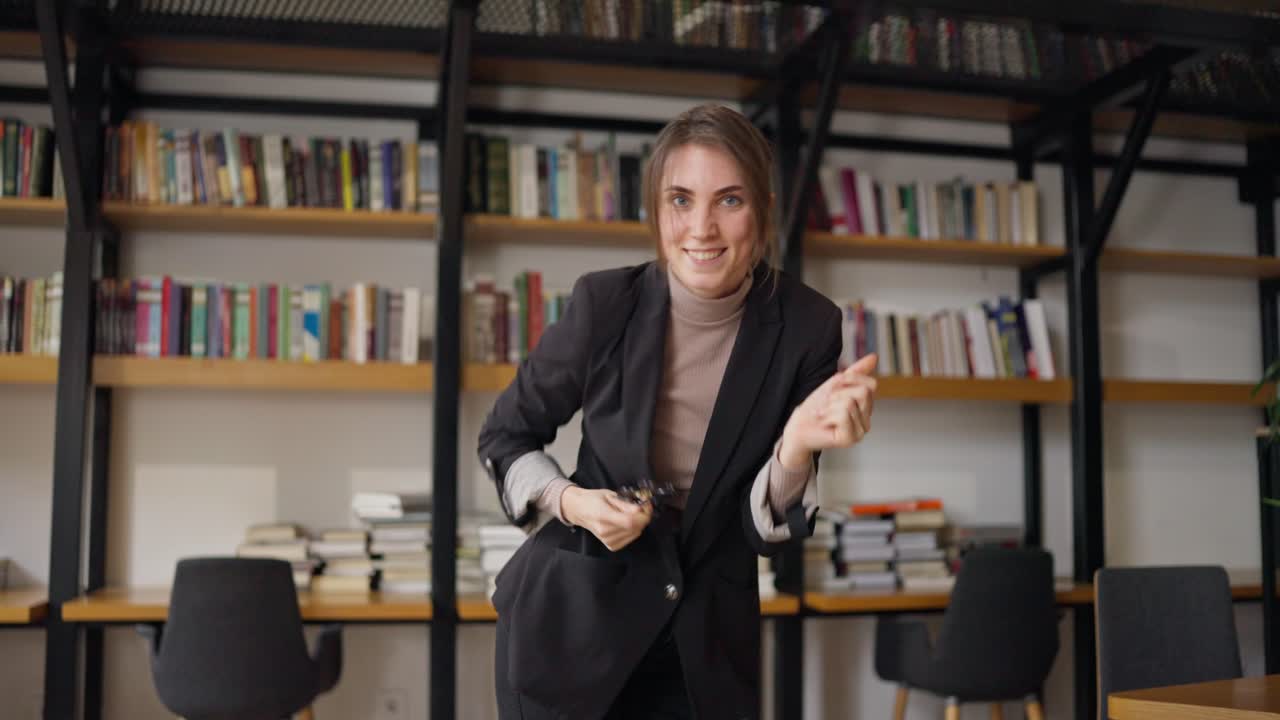 Woman Dancing in a Modern Office/Library