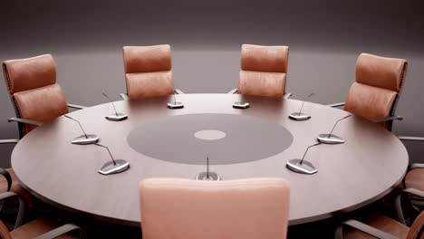 round conference table on dark background rotates 360 degrees. closeup.