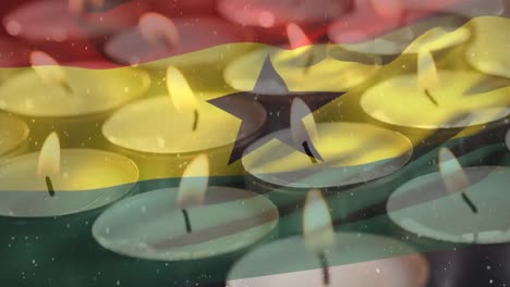 animation of flag of ghana over candles