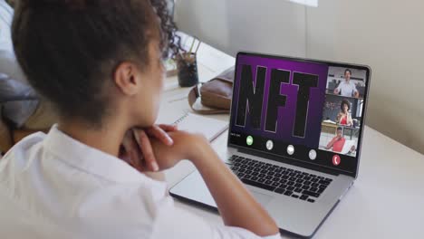 video of biracial woman having nft video call on laptop with diverse coworkers
