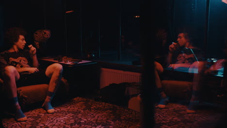 men smoking in a retro night club