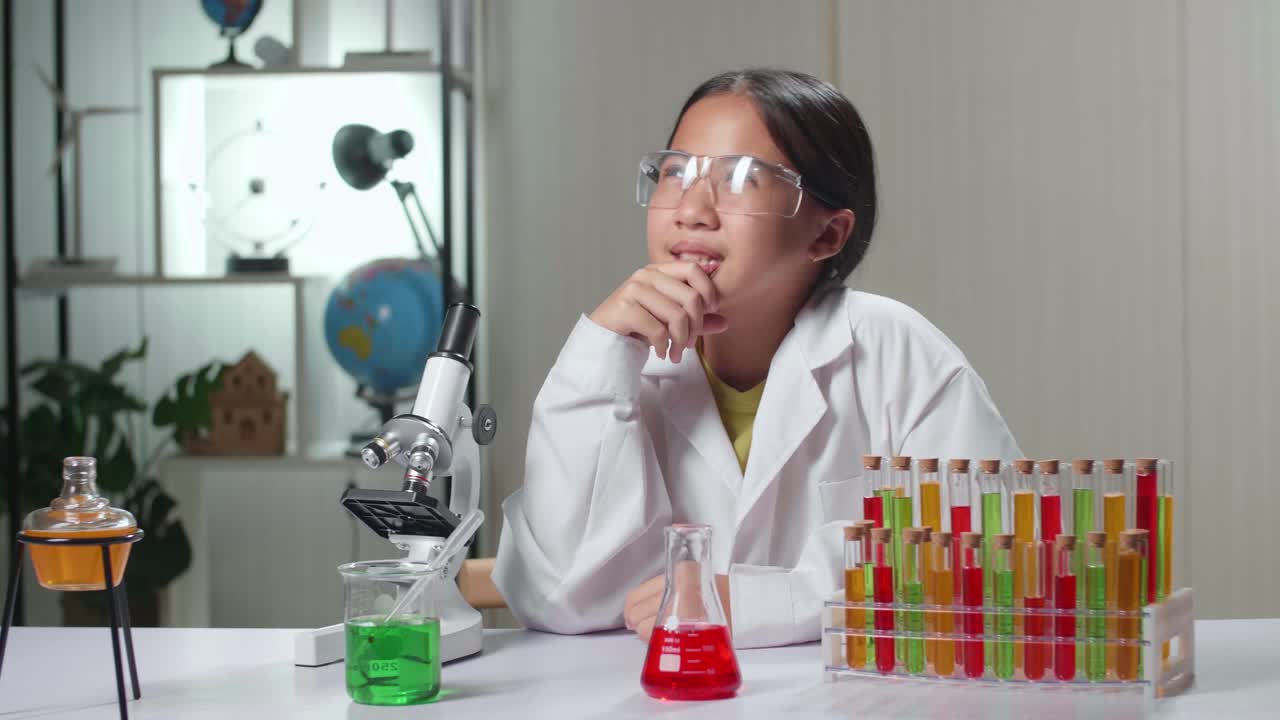 Young Scientist Girl Looking At Microscope And Thinking In Laboratory Experiment With Liquid