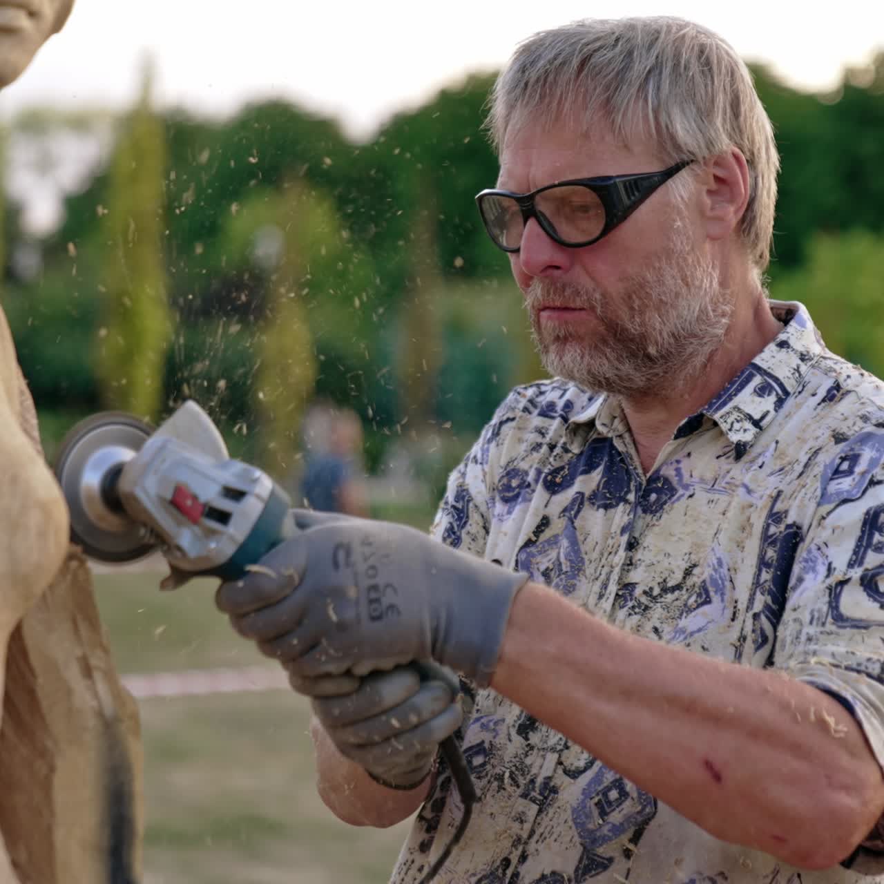 Artist making wooden sculpture. Craftsman professional worker