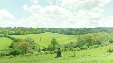 man admiring the view of the countryside