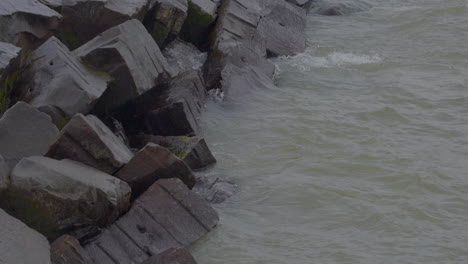 slo-motion-shot-of-waves-crashing-against-the-break-wall-in-Great-Lakes