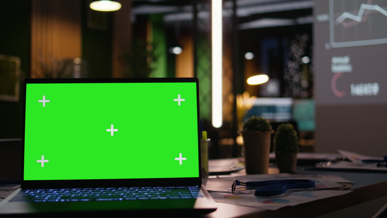 Empty modern workspace of a global enterprise with a chroma key screen