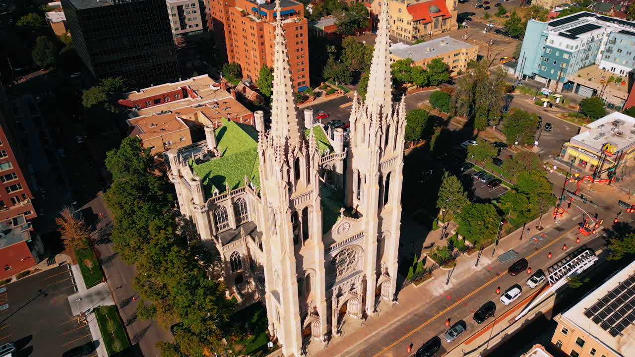 Denver, USA, 28 July 2025: Spectacular towers of beautiful Cathedral Basilica of the Immaculate Conception in Denver, Colorado, USA. Façade of the church lit with bright sun
