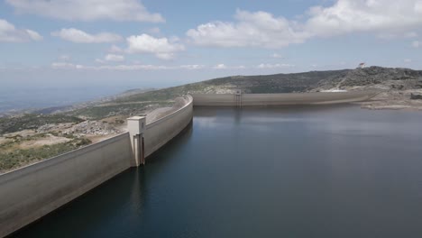 a drone flies over lagoa comprida a lagoon in the mountains of portugal