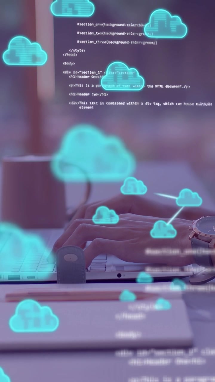Vertical video: Hands typing on laptop, generating code and cloud icons drifting over keys for tech
