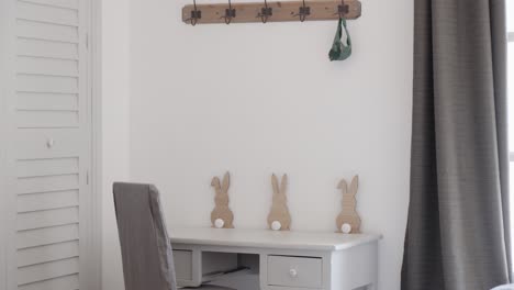 slow revealing shot of a children's desk in a bedroom within a villa