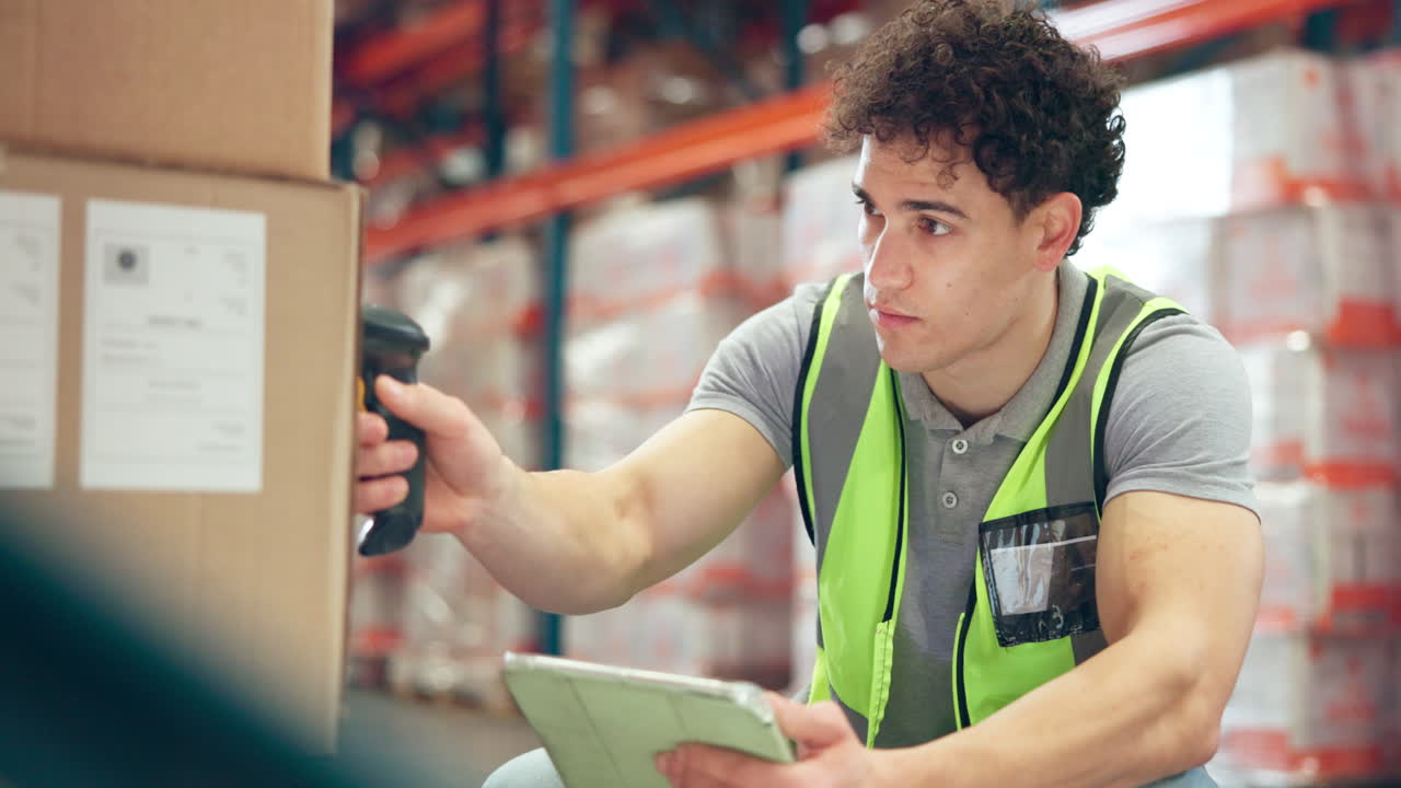 Man scanning barcodes in a warehouse