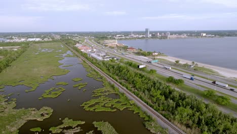 wide shot of lake charles, louisiana skyline with bayou and freeway