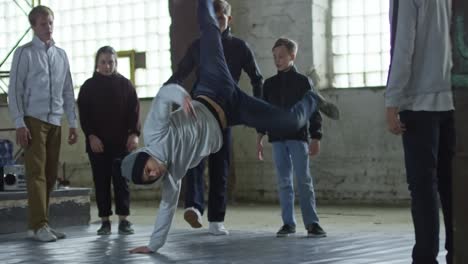 teenager jumping into handstand