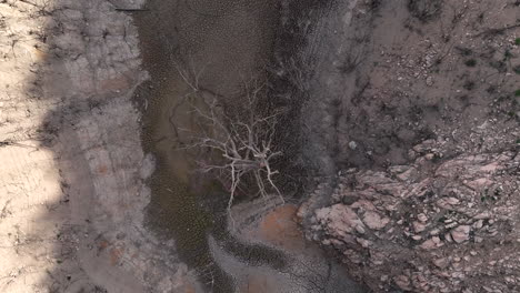 dry out river valley during extreme drought in spain, aerial drone view