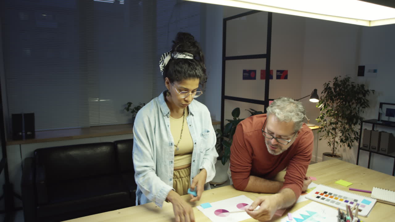 Colleagues Working on Project at Night Office