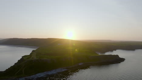 sunset over coastal landscape