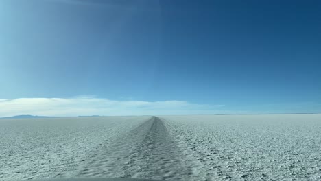 uyuni salt flat bolivia dry prehistoric lake white landscape car ride pov south america