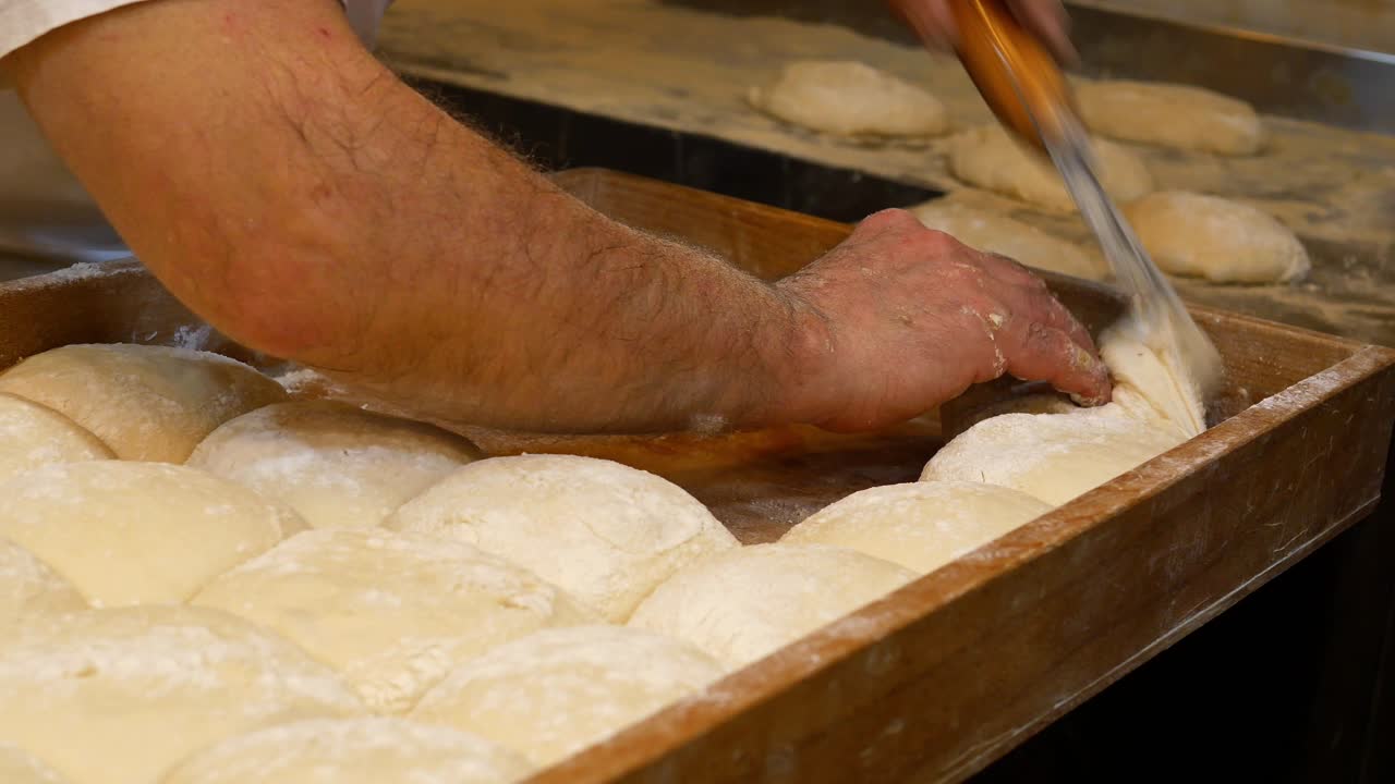 Baker preparing dough