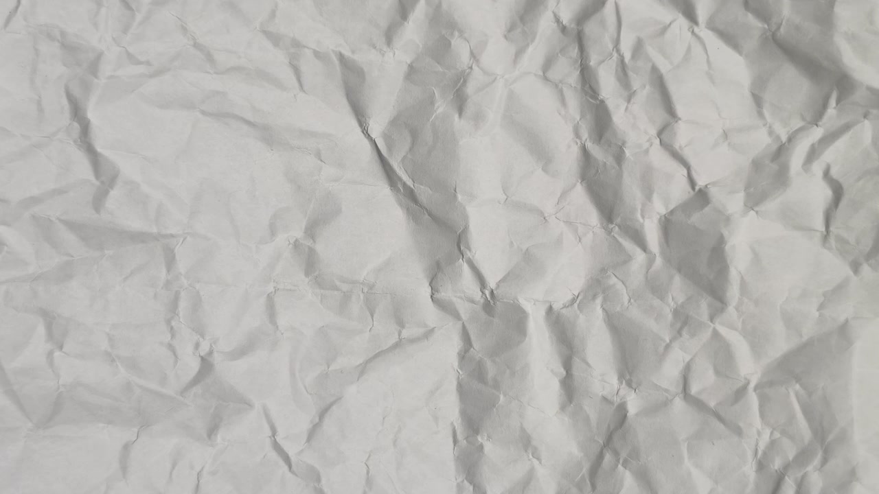 Nahaufnahme einer Textur aus weißem, zerknittertem Papier