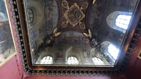 detailed view of louvre's ceiling and paintings