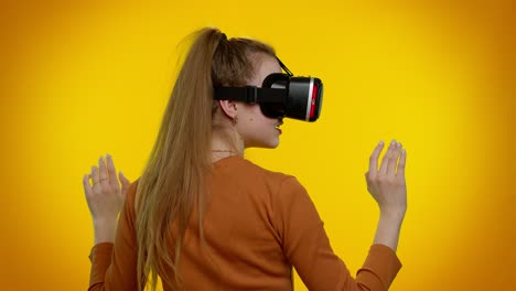 girl using virtual reality futuristic technology vr headset helmet to play simulation 3d video game