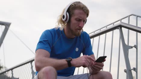 sporty caucasian man on a bridge