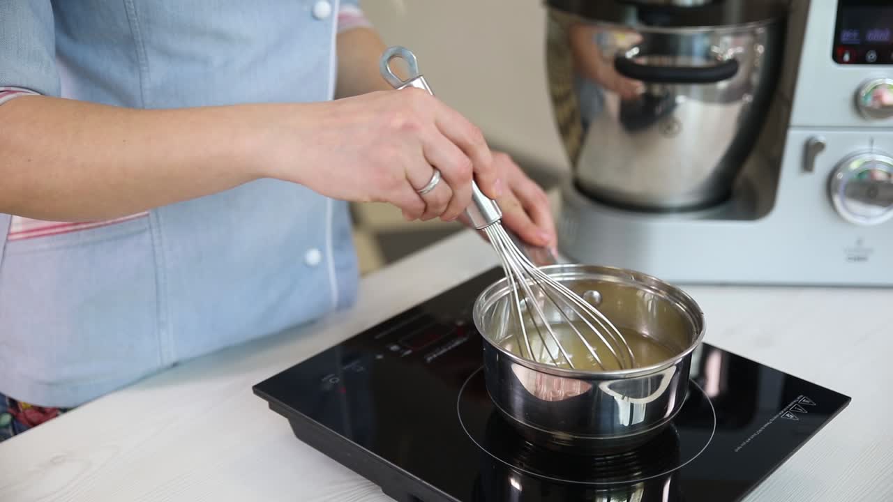 Woman Cooking a Dish on Electric Stove