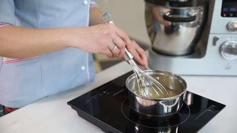 woman cooking a dish on electric stove