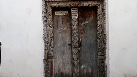 close up view of typical arab door located in mji mkongwe