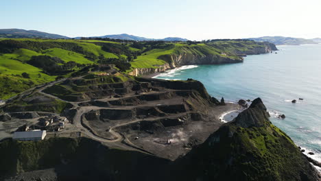 establishing high angle drone shot of blackhead quarry in new zealand