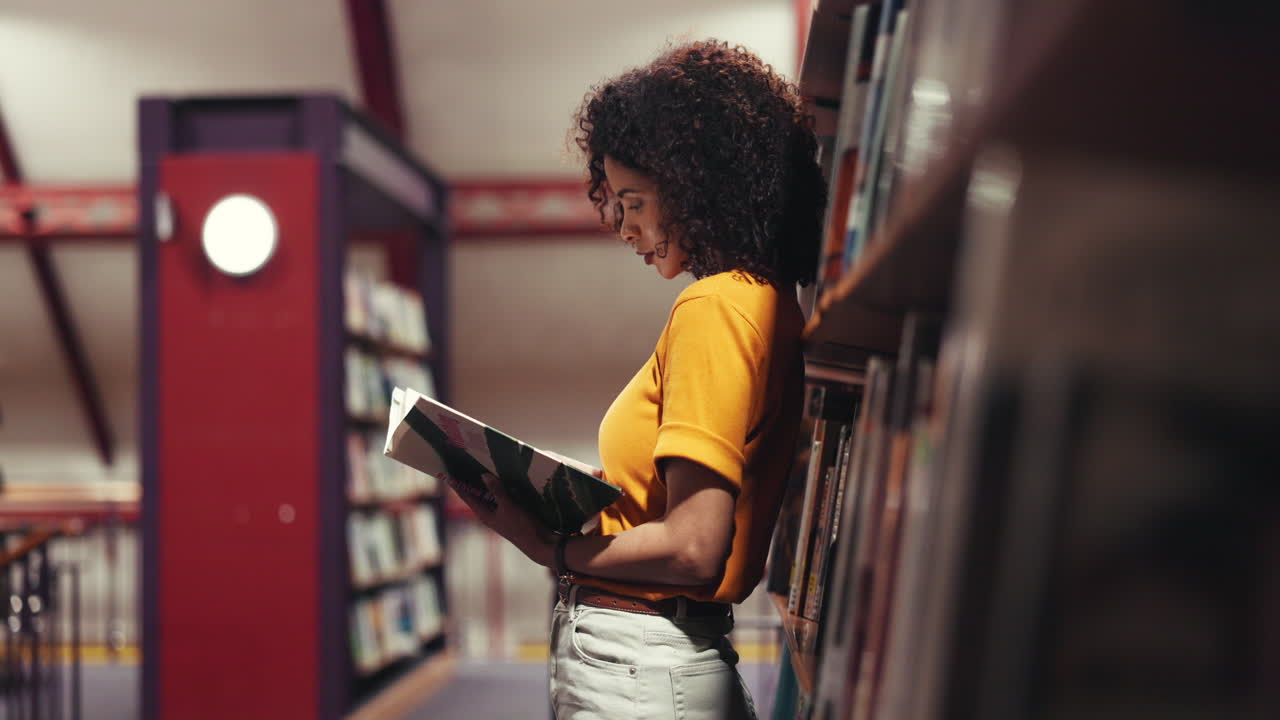 Woman reading a book in the library