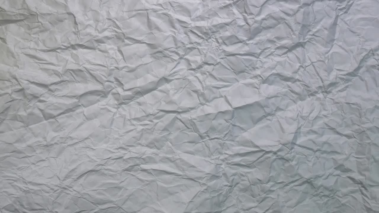 Animazione in loop in stop motion di sfondo con texture di carta bianca stropicciata.