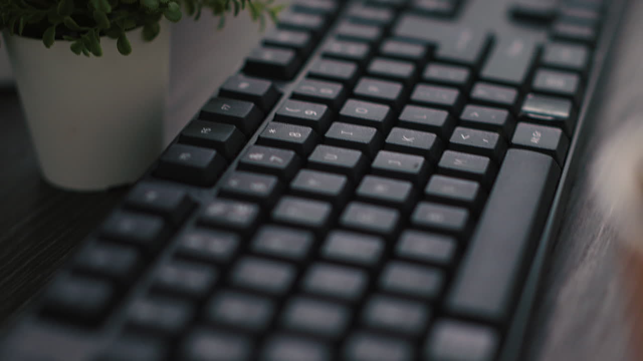 Computer keyboard and business graphs and figures on paperwork files