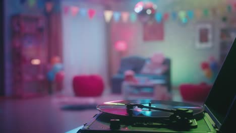 blurry neon party room with turntable