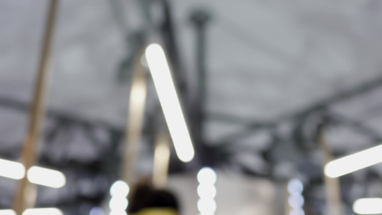 Spinning carousel in the amusement park at night. Look up. Out of focus.