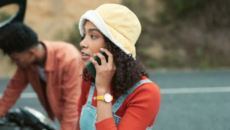 young adults experiencing car trouble and calling for help