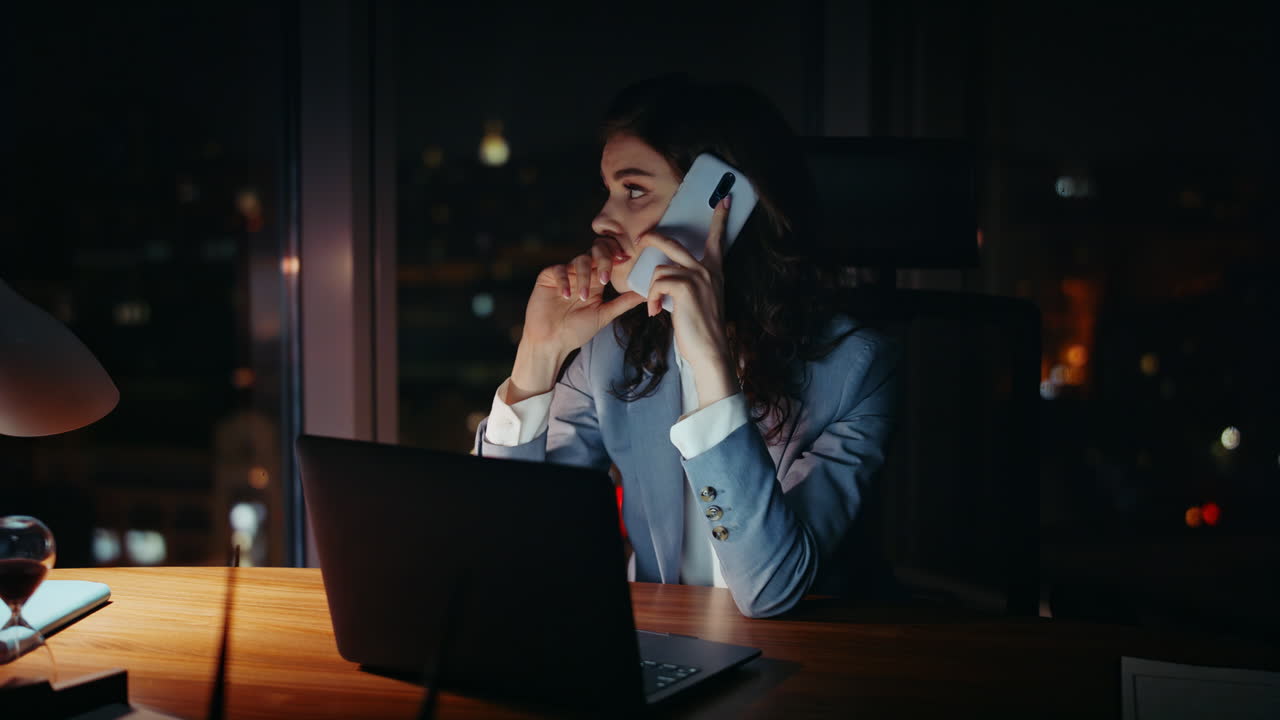 Girl manager complaining telephone conversation sitting office evening close up