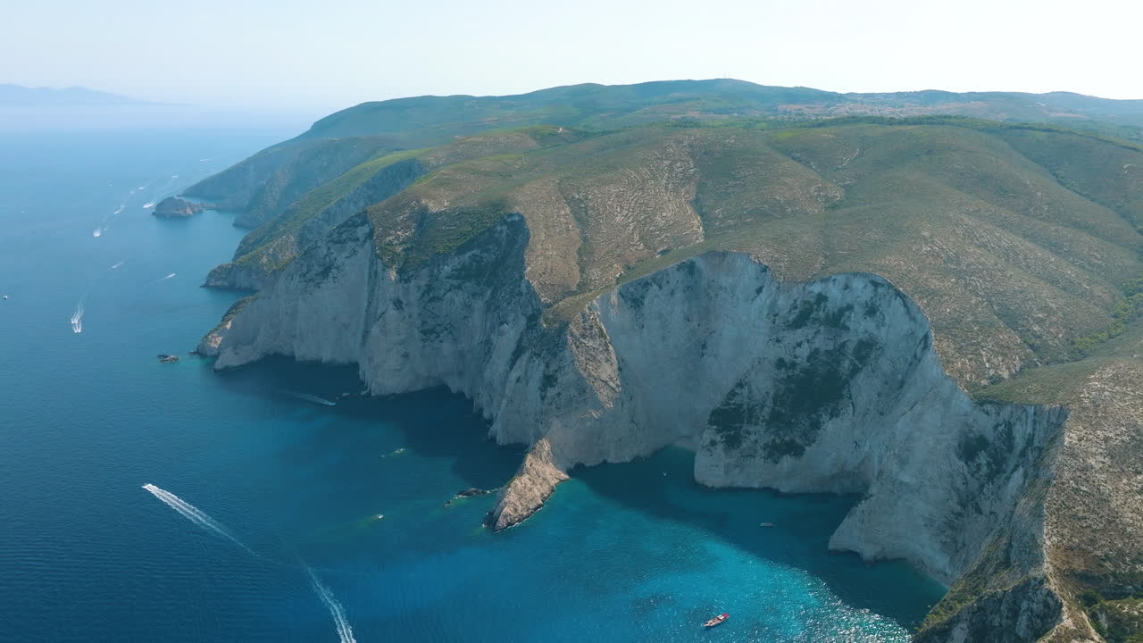Aerial view of a beautiful coastline with cliffs and a vibrant blue sea
